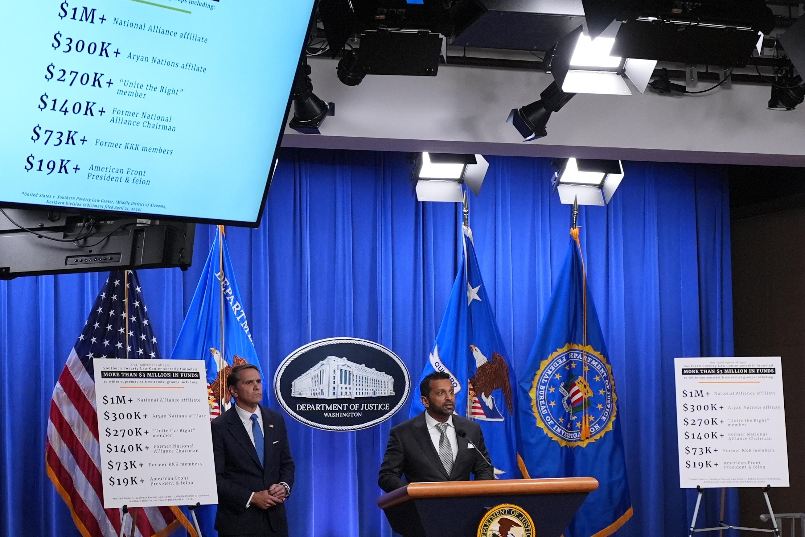 Acting Attorney General Todd Blanche listens as FBI Director Kash Patel speaks at a news conference at the Justice Department, Tuesday, April 21, 2026, in Washington.