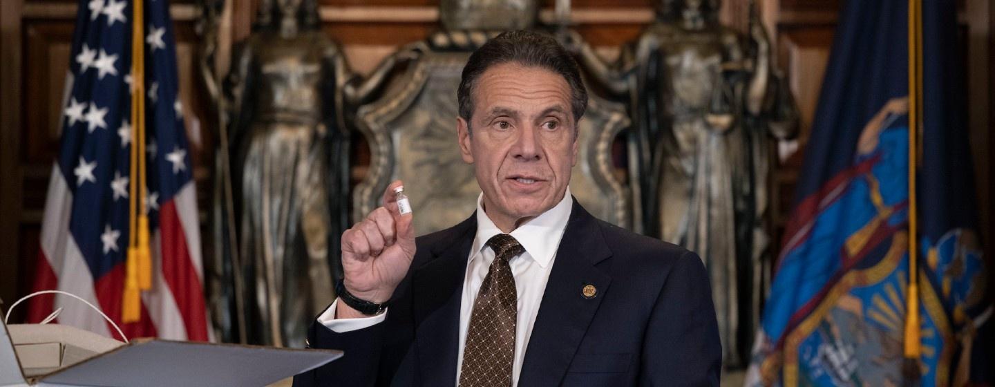 Governor Cuomo holds a mock vial of COVID-19 vaccine.
