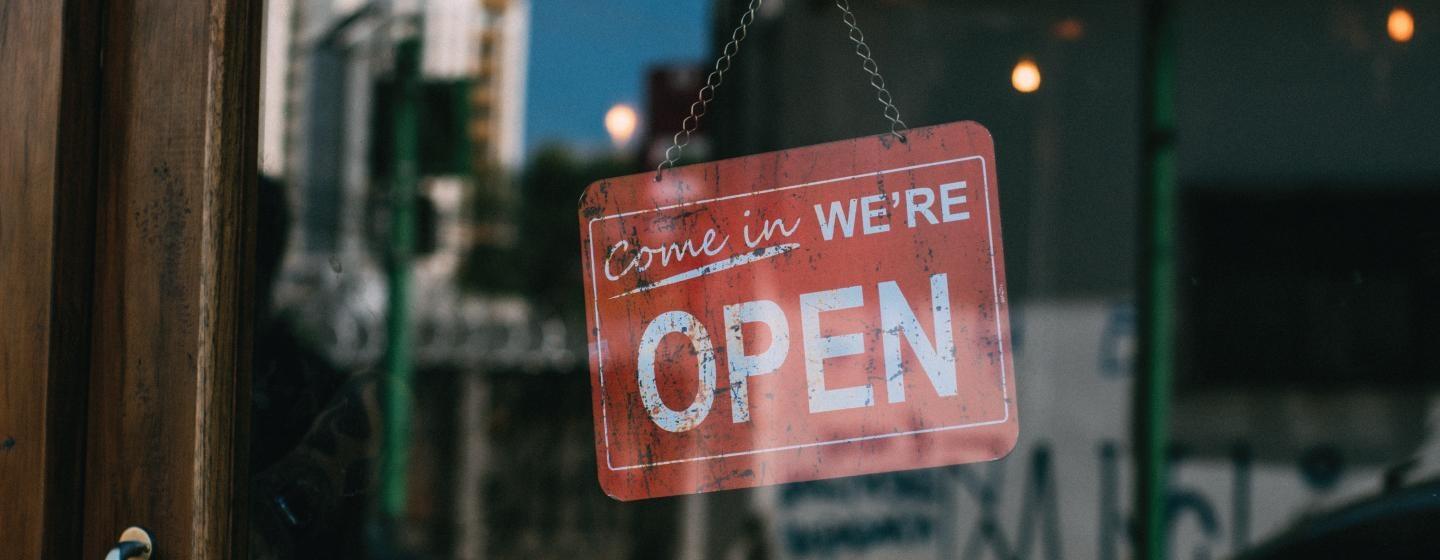 Open for business sign on door