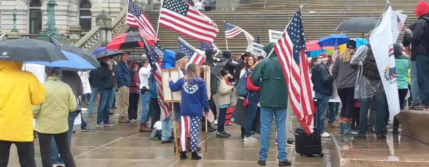 Protestors stage a rally at the state capitol on Friday, May 1, 2020.