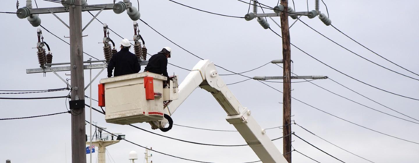 Utility workers tending to power lines