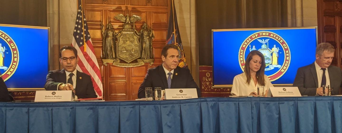 Gov. Andrew Cuomo speaks with reporters at the state capitol.