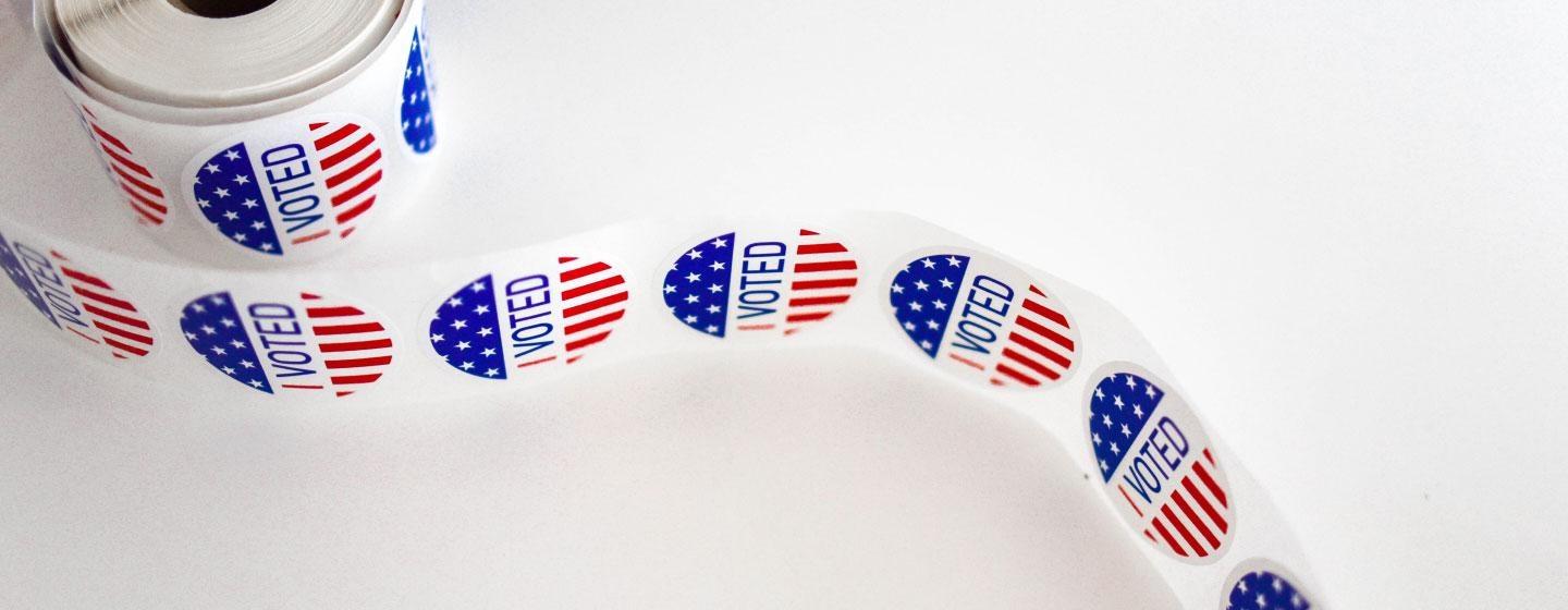 Image of a roll of I Voted stickers in red, white and blue