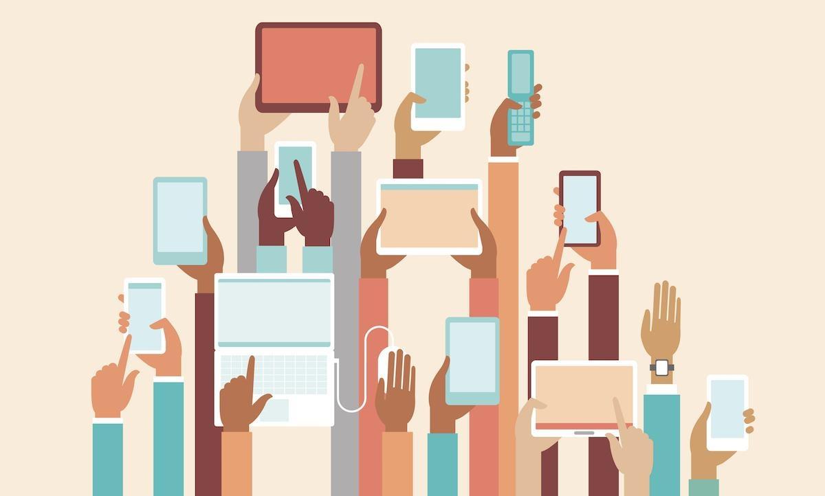 Image of hands holding technology devices