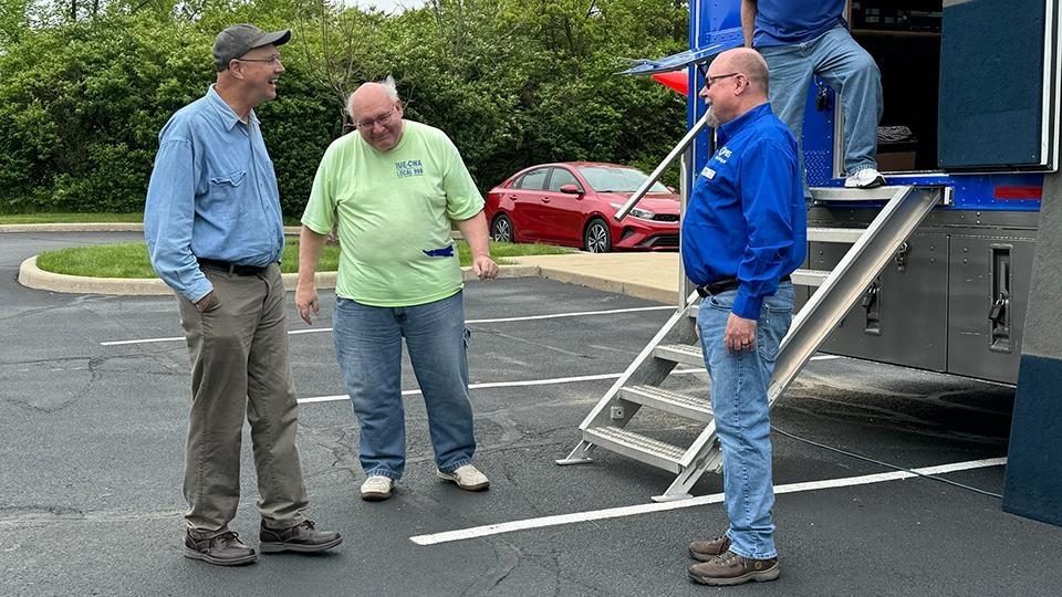 Todd Grimes and visitors at the remote truck-2024 Open House