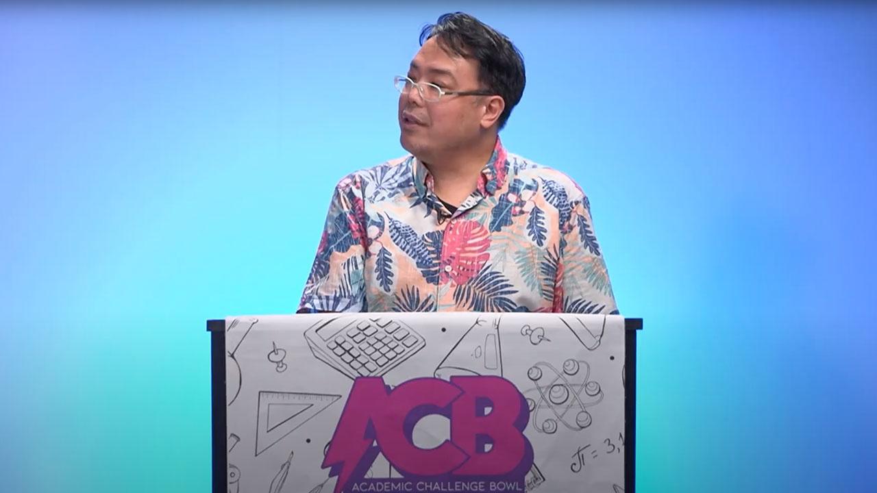 Academic Challenge Bowl host Ernest Ochoco in studio on the set of the Academic Challenge Bowl in PBS Guam studios