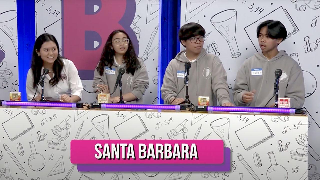 Four students from Santa Barbara are seated while they discuss their answers on set of the Academic Challenge Bowl