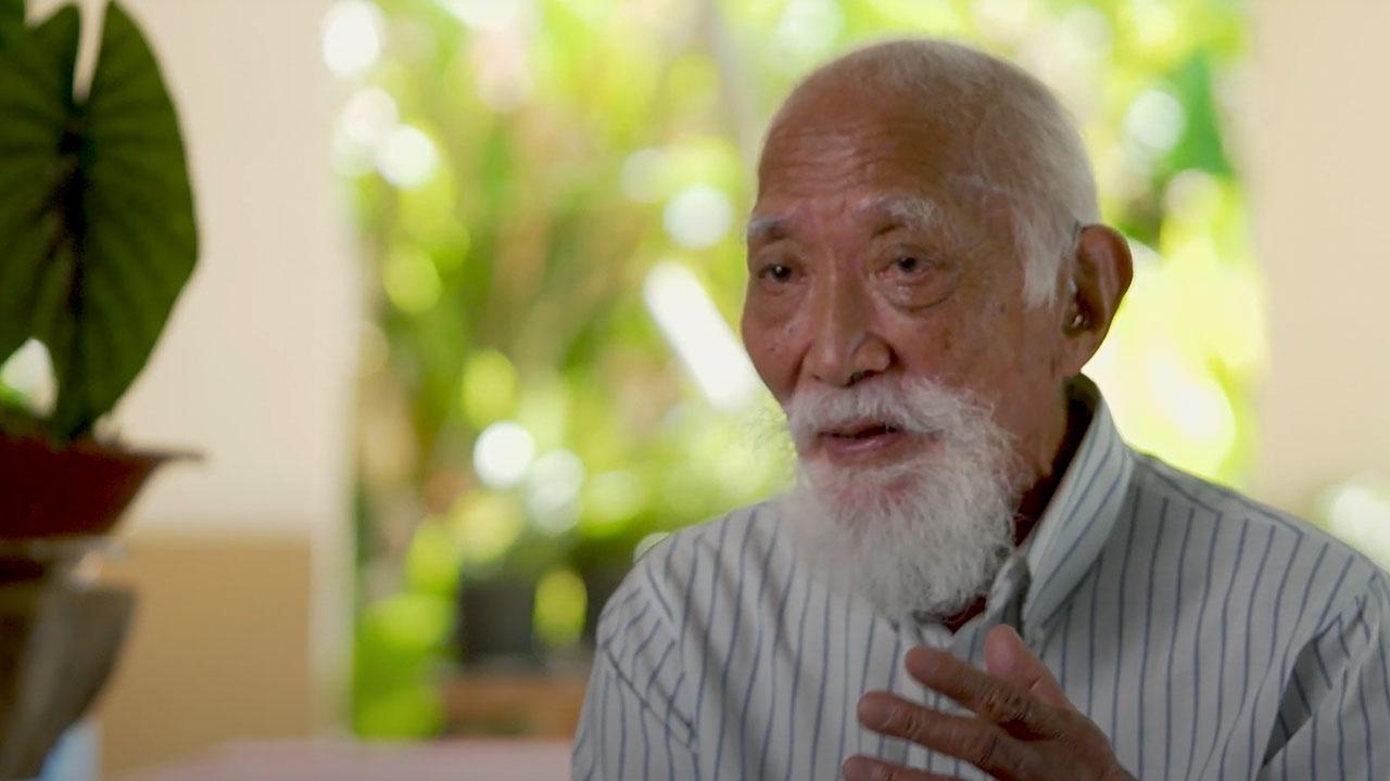 An elderly CHamoru man is being interviewed