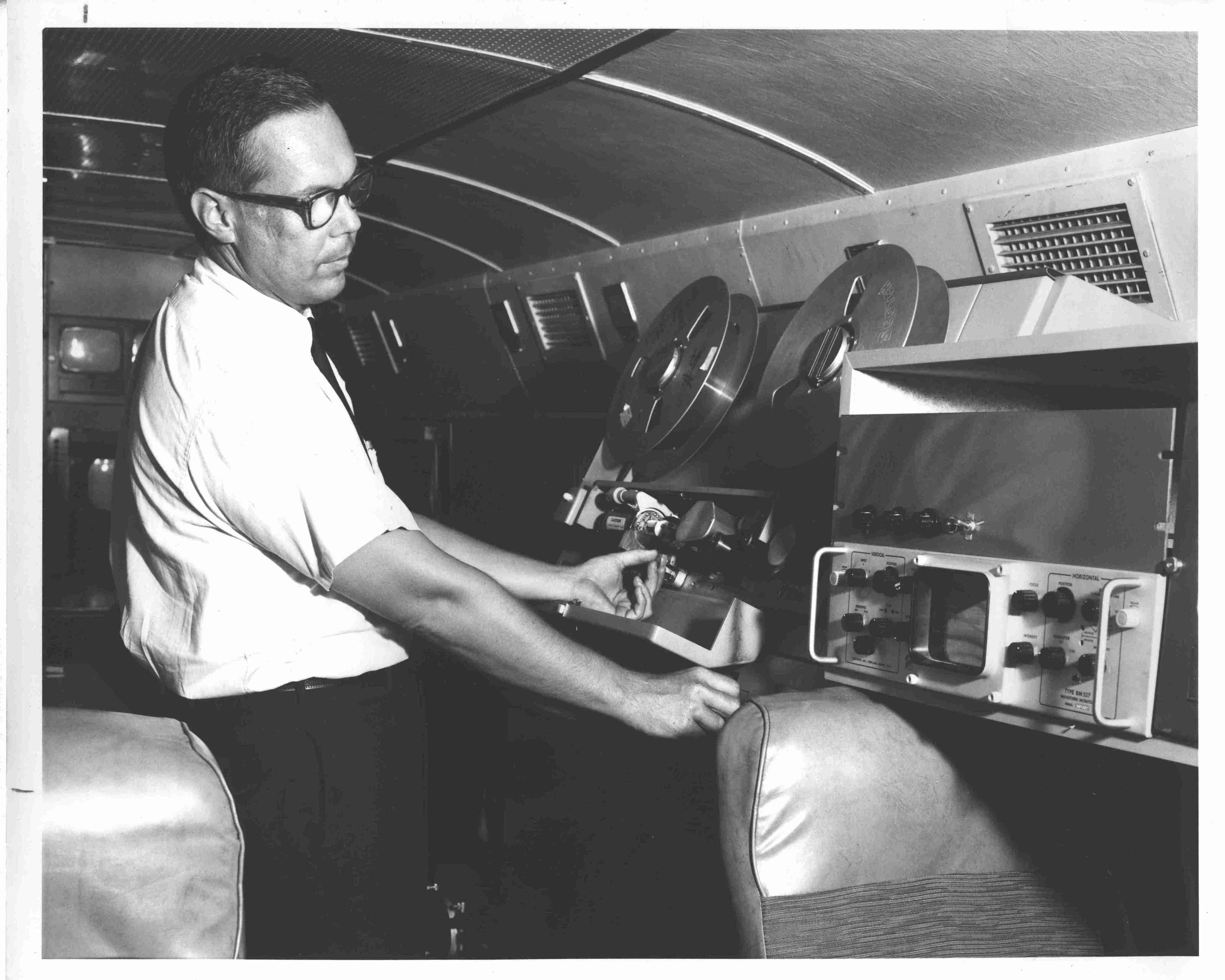 On the remote bus, an engineer records on a 2” videotape machine, watching video levels from the late 50s, early 60s.