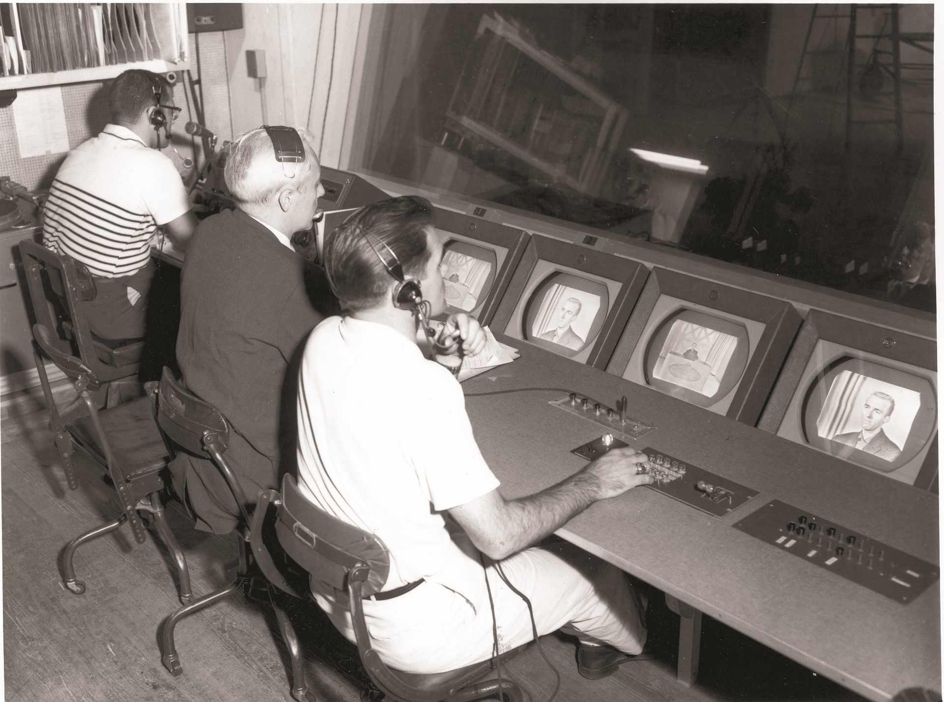 Early master control operators from the late 1960s prepare educational television production for in-school broadcast.