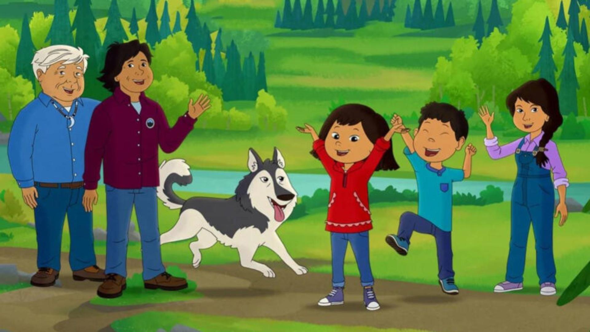 Molly of Denali, her family and dog standing in a celebratory line together.