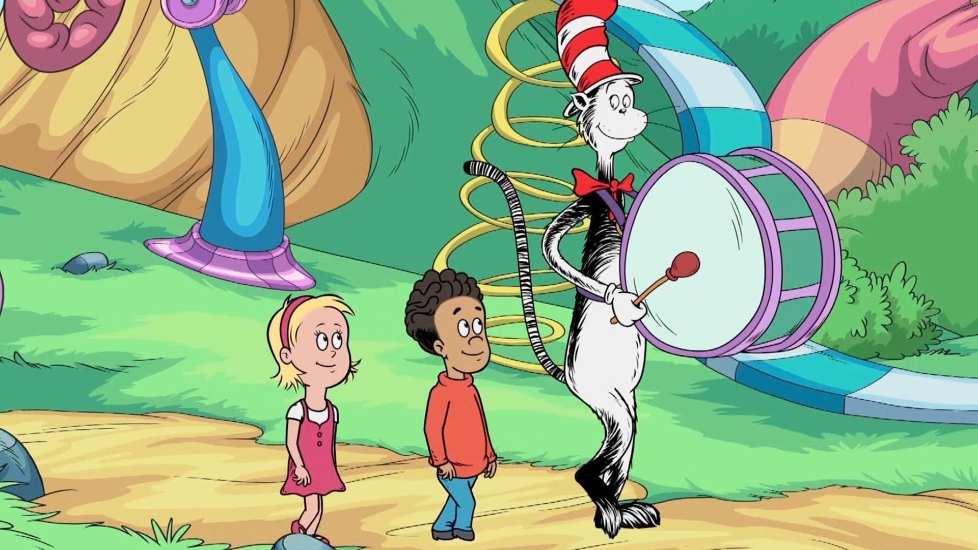 Nick and Sally walk down a path with Cat in the Hat whose playing a marching bass drum.