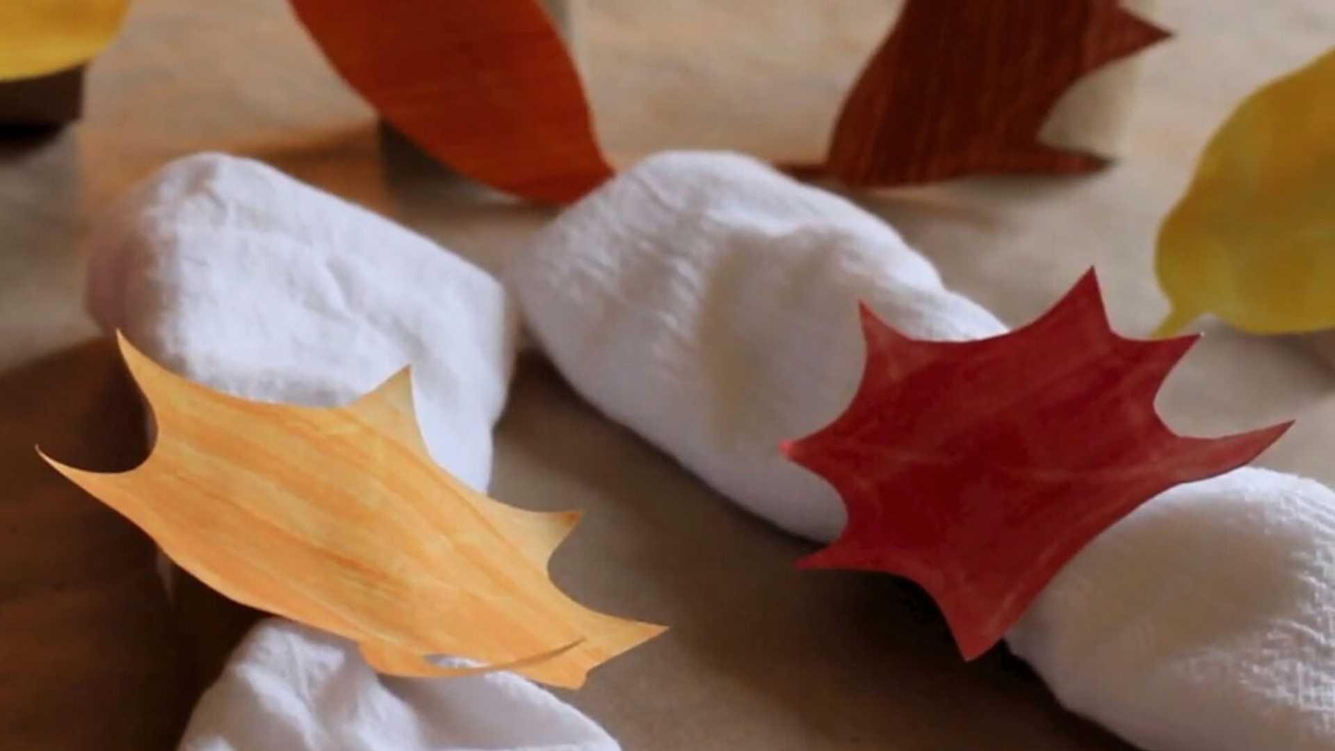 White napkins with a leaf napkin ring