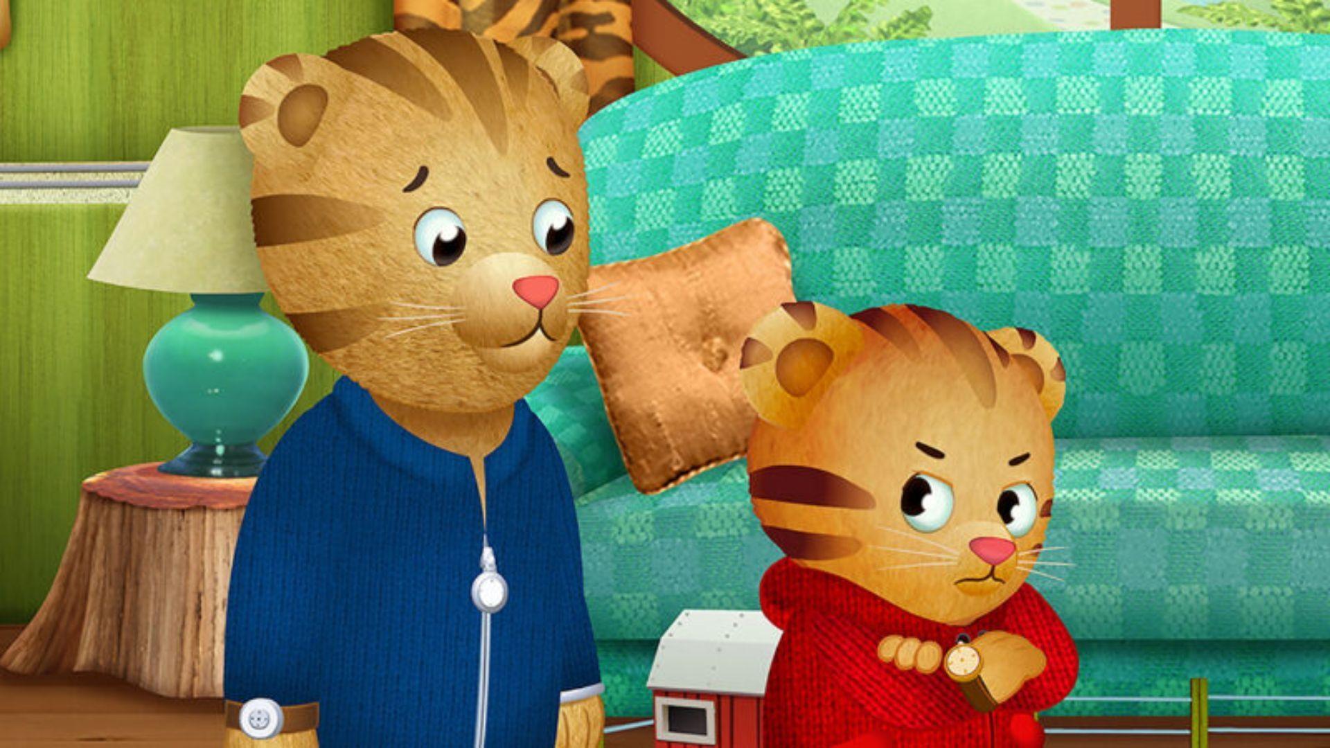 Daniel Tiger looking grumpy while faced away from Dad Tiger.