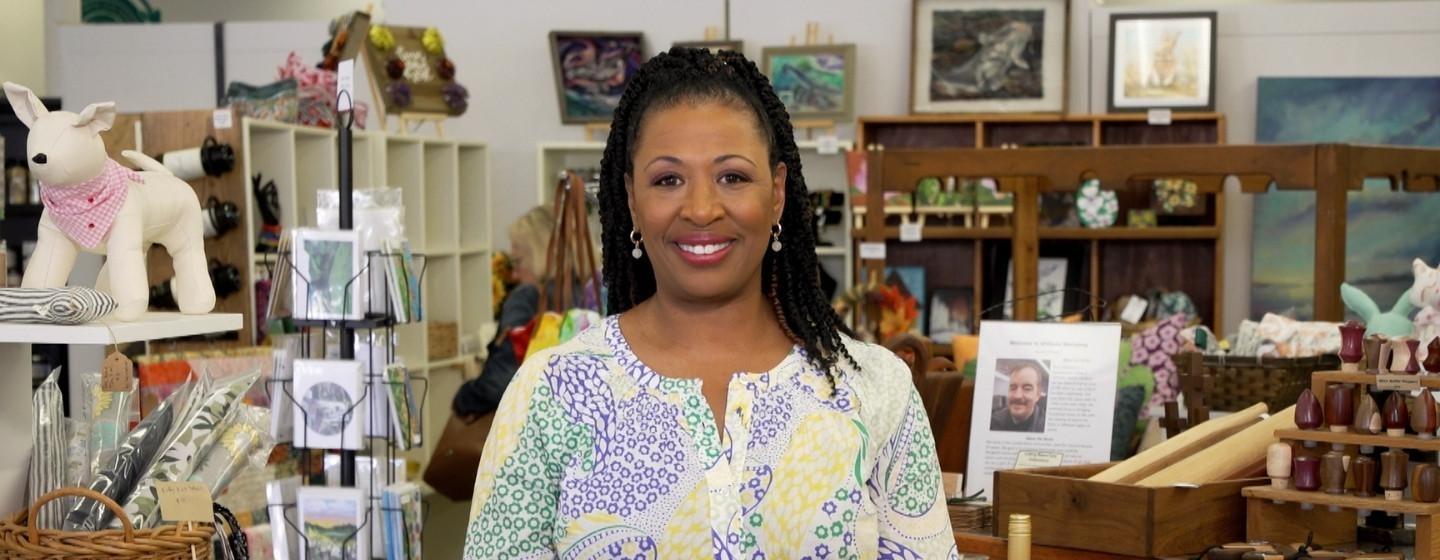 Host of NC Weekend, Deborah Holt Noel inside of a store.