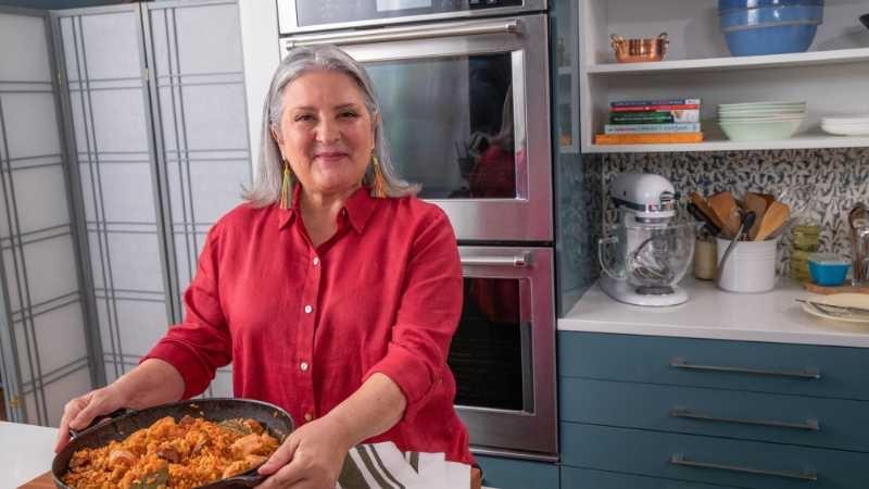 Sheri Castle presents a rice dish in a kitchen
