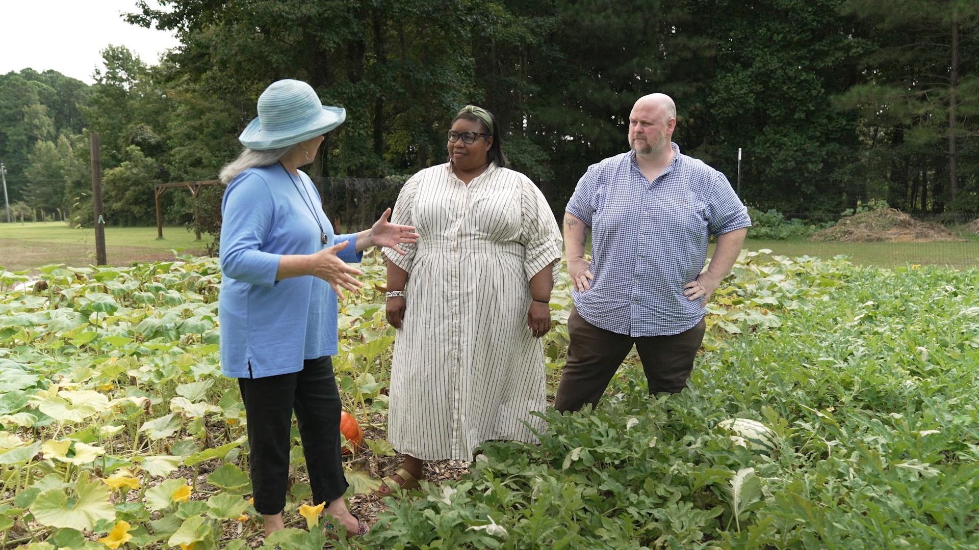 Sheri Castle with Deb Freeman and Joshua "Fitz" Fitzwater as they stand in a watermelon patch.