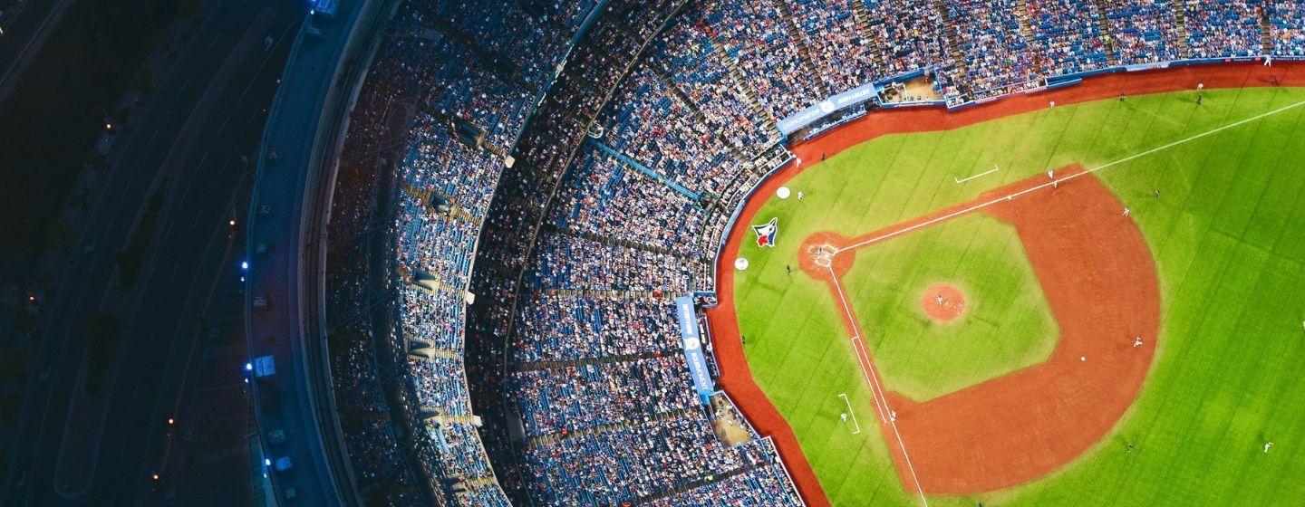 An aerial view of a fan-filled baseball stadium.