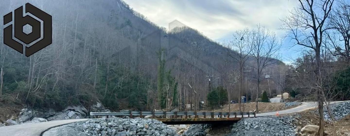 A rail car bridge with a mountain in the background. Image courtesy of Innovative Bridge Company.