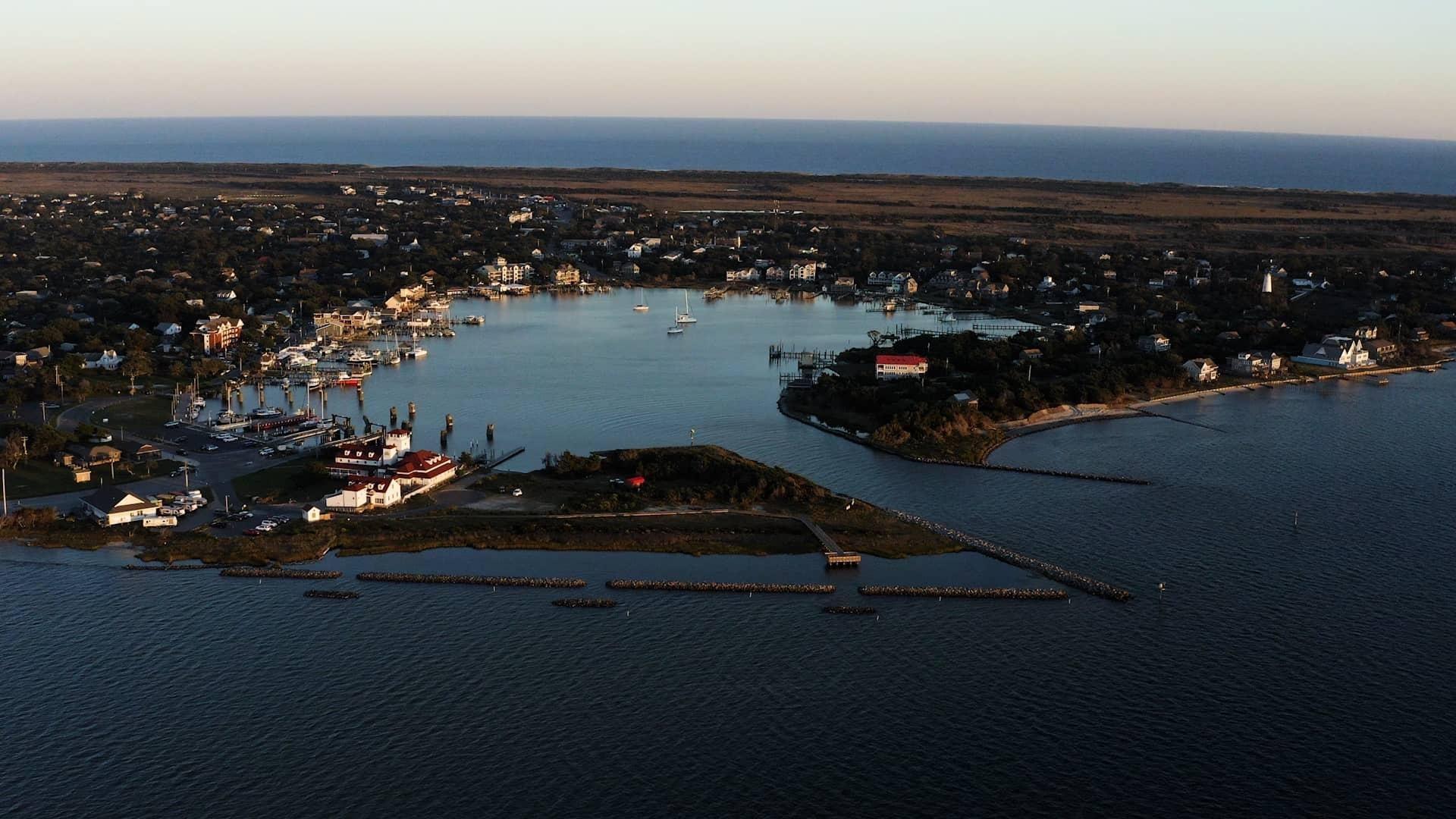 aerial shot of ocracoke coast at early night late evening