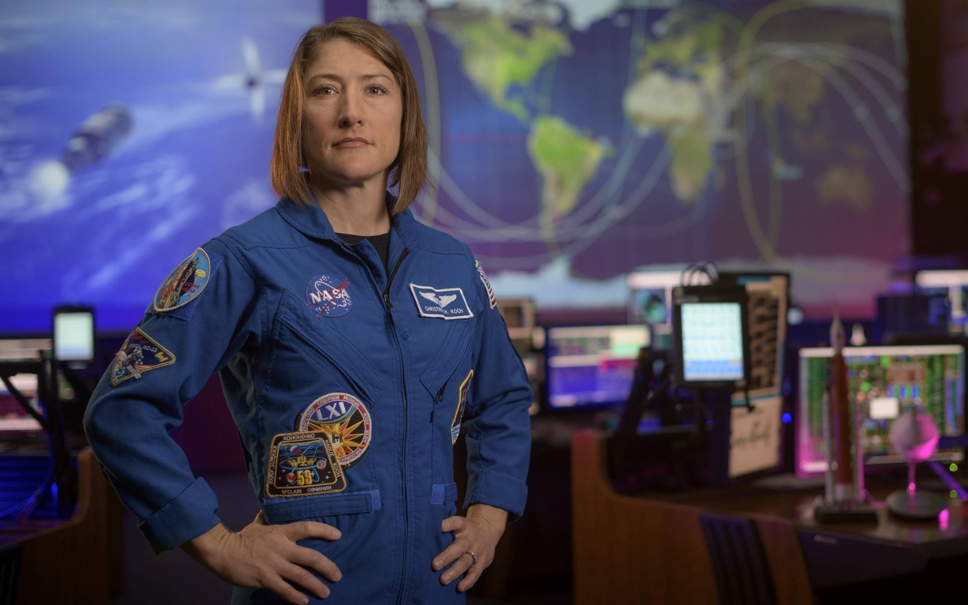 female astronaut christina koch nasa standing with arms on hips