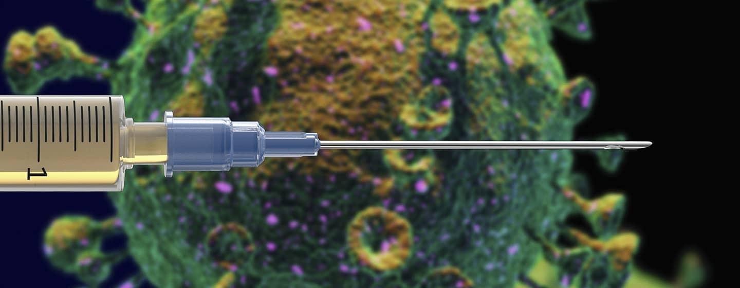 vaccine needle pointed horizantally close up with virus 3d graphic rendering in background