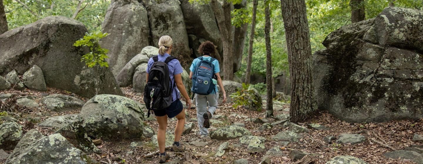 Two hikers on NC Zoo's Ridge Mountain.