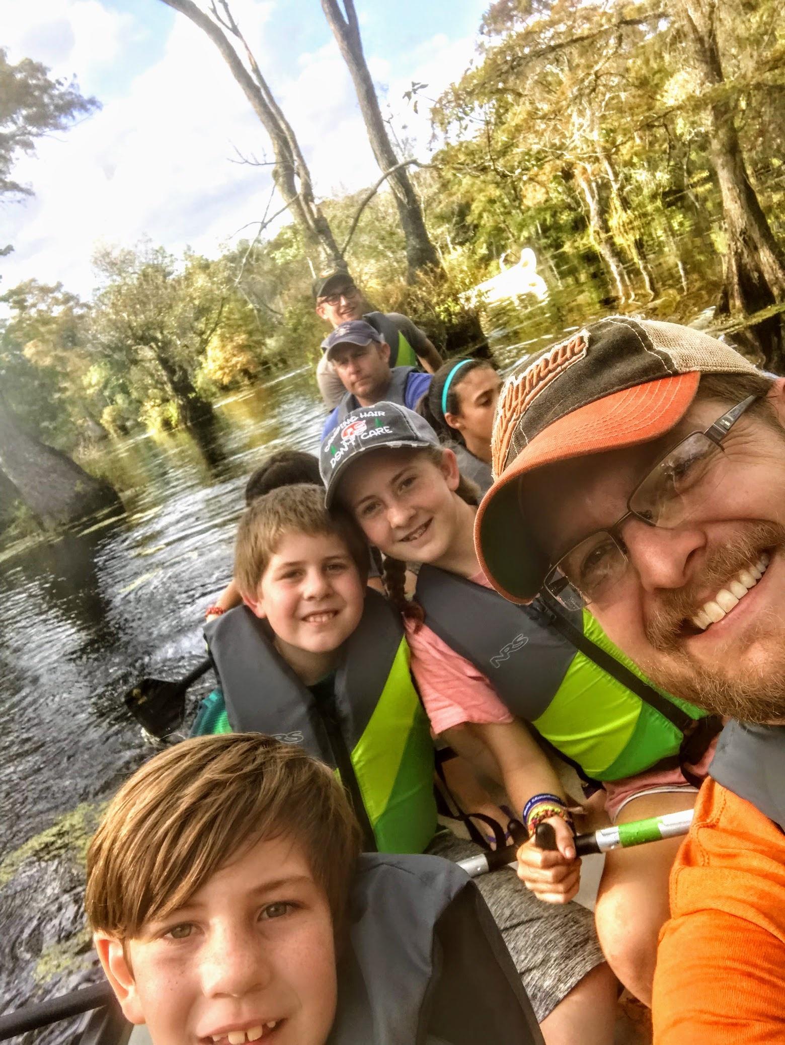 Adults and children on a kayak at Merchants Millpond