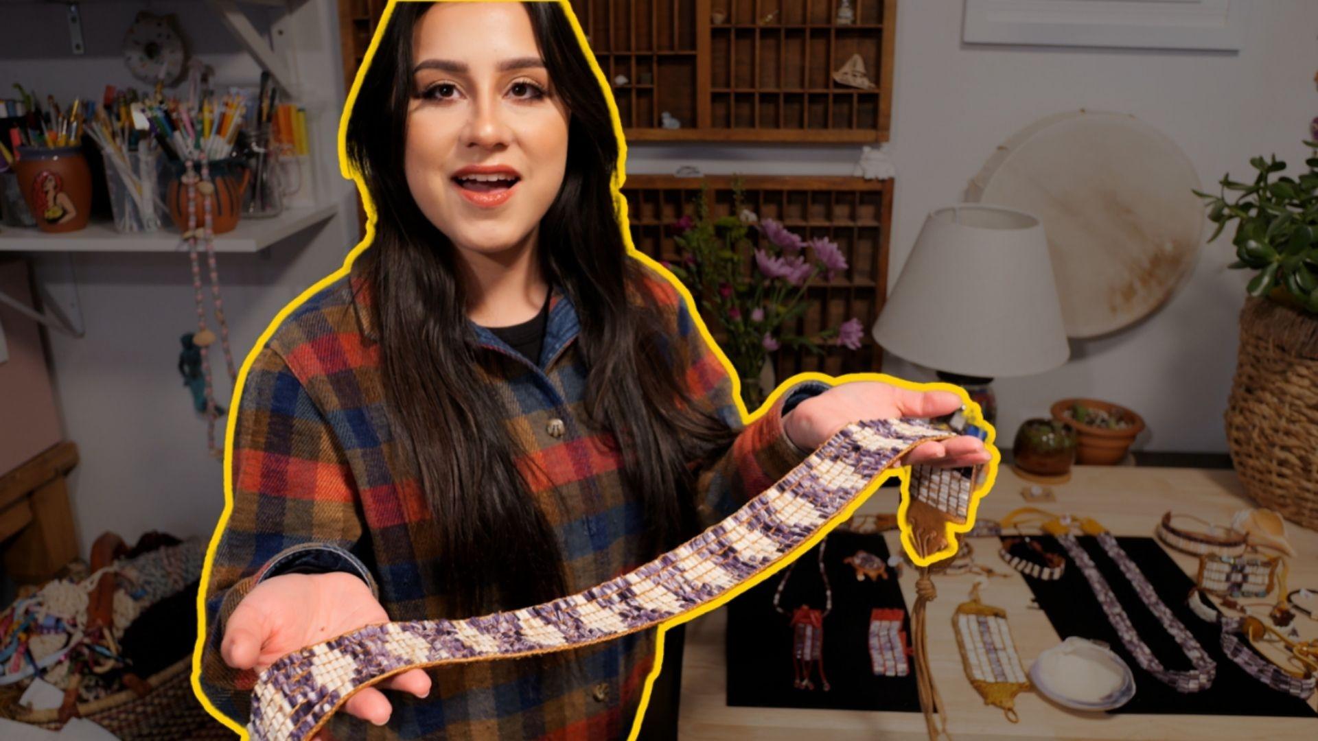 Cheyenne Bearfoot holding up a molted snakeskin.