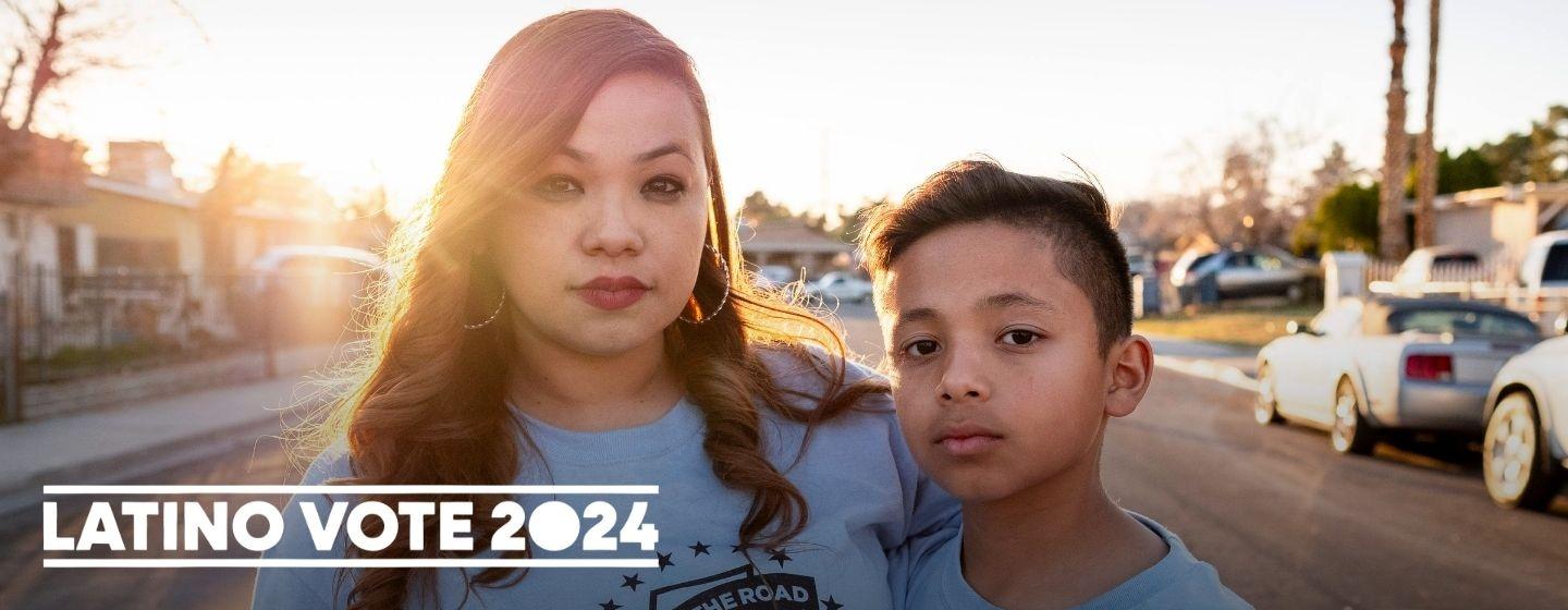 Organizer Audrey Peral and son Francisco in 2020 with the Latino Voces 2024 logo in white.