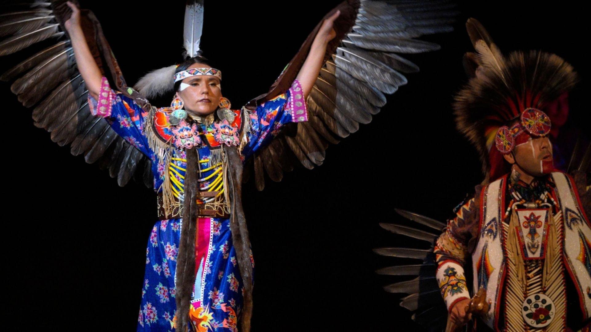 Native Americans in ceremonial dress.