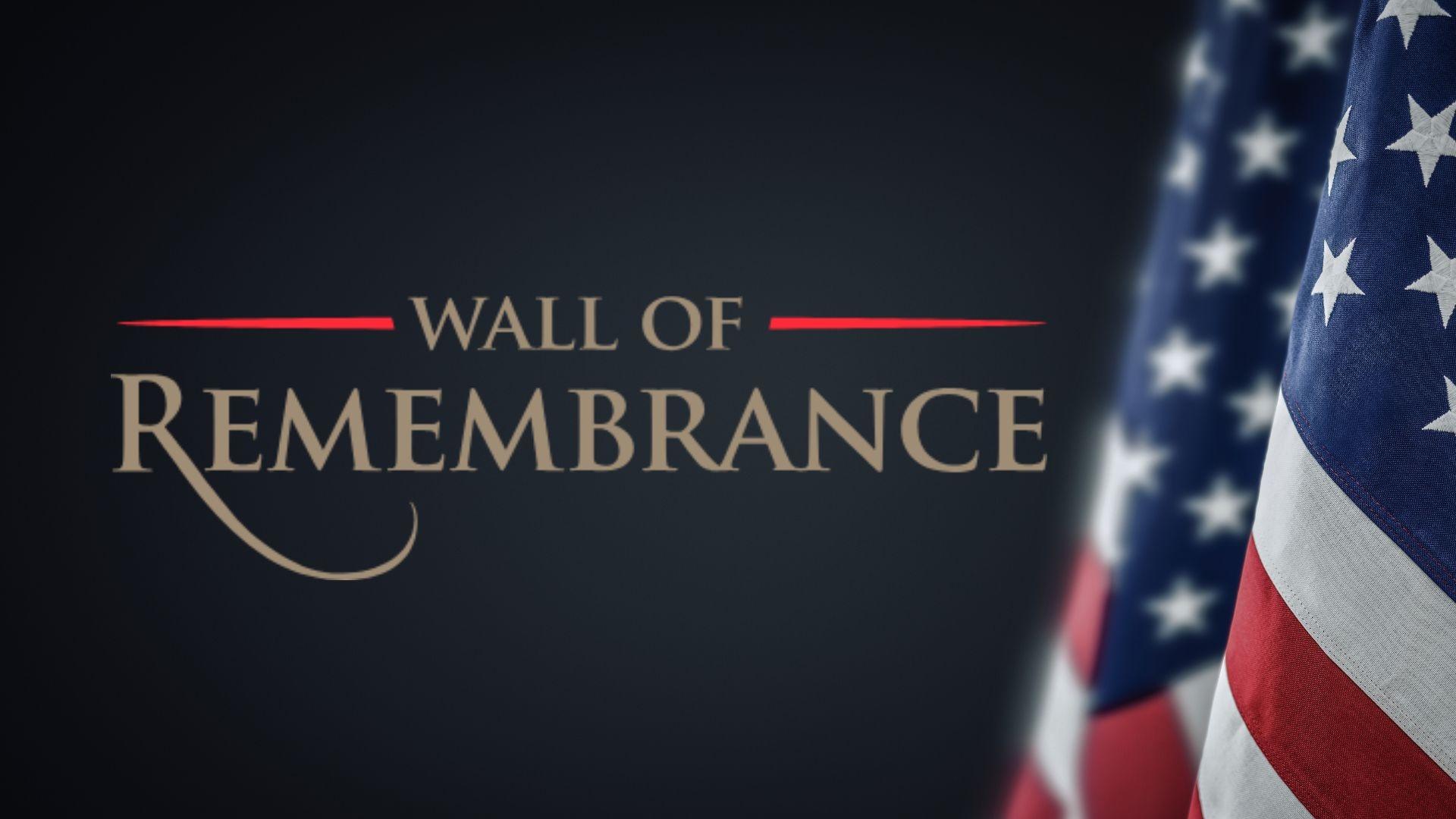Wall of Remembrance with the United States flag to the right.