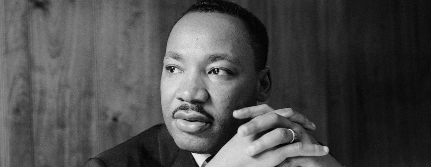 A black and white photograph of Martin Luther King Jr.