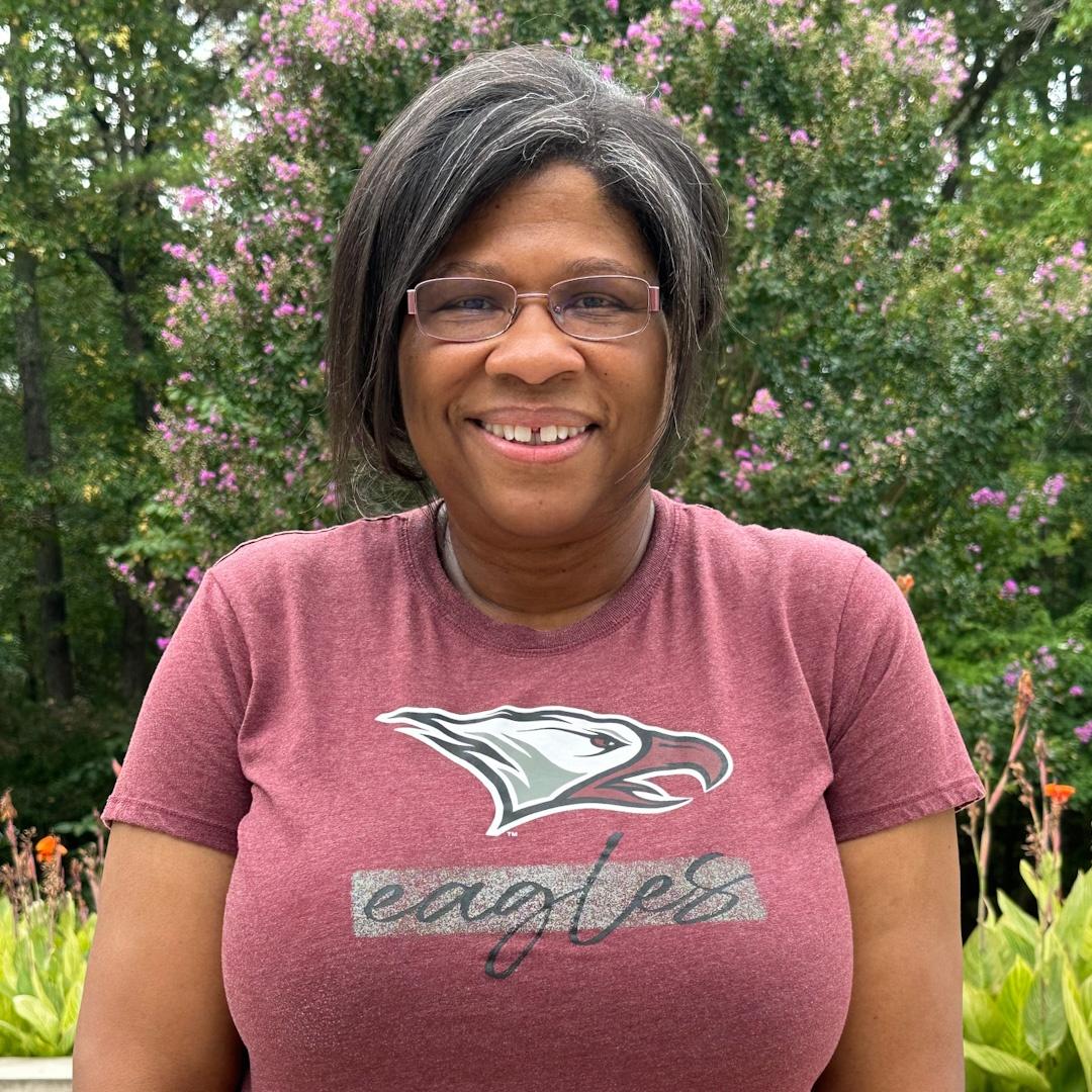 Angelique Craig-More wearing a maroon NCCU eagles tee shirt.