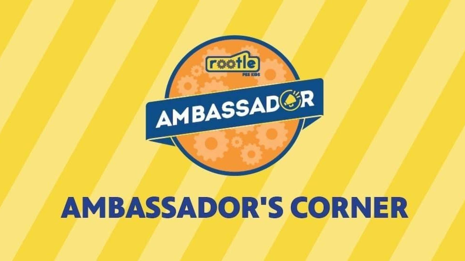 Rootle Ambassador logo with a dark and light yellow striped background and the words, "AMBASSADOR'S CORNER"