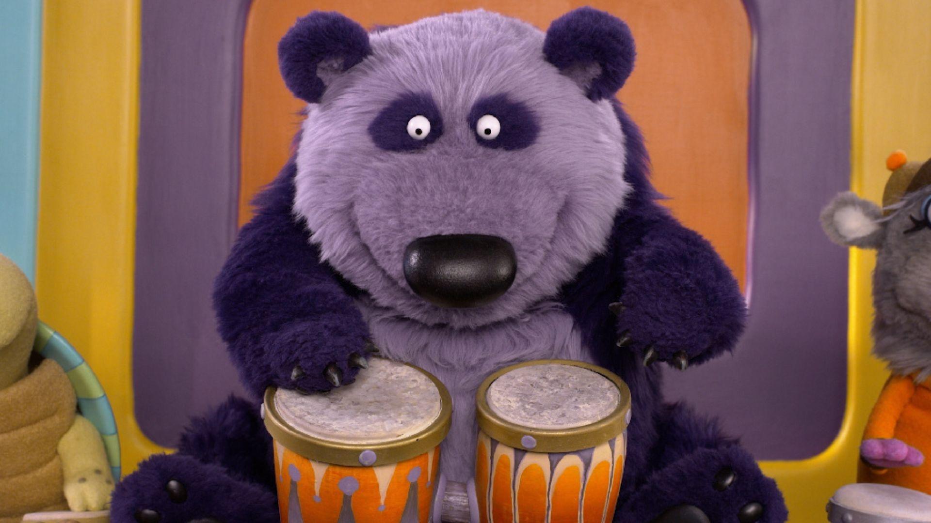 Purple Panda plays the bongos in Donkey Hodie.