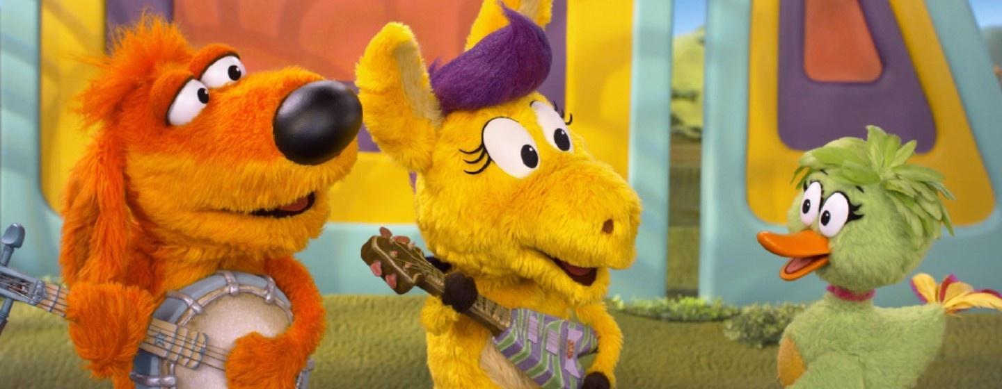 Bob Dog and Donkey Hodie play the banjo and guitar to Duck Duck.