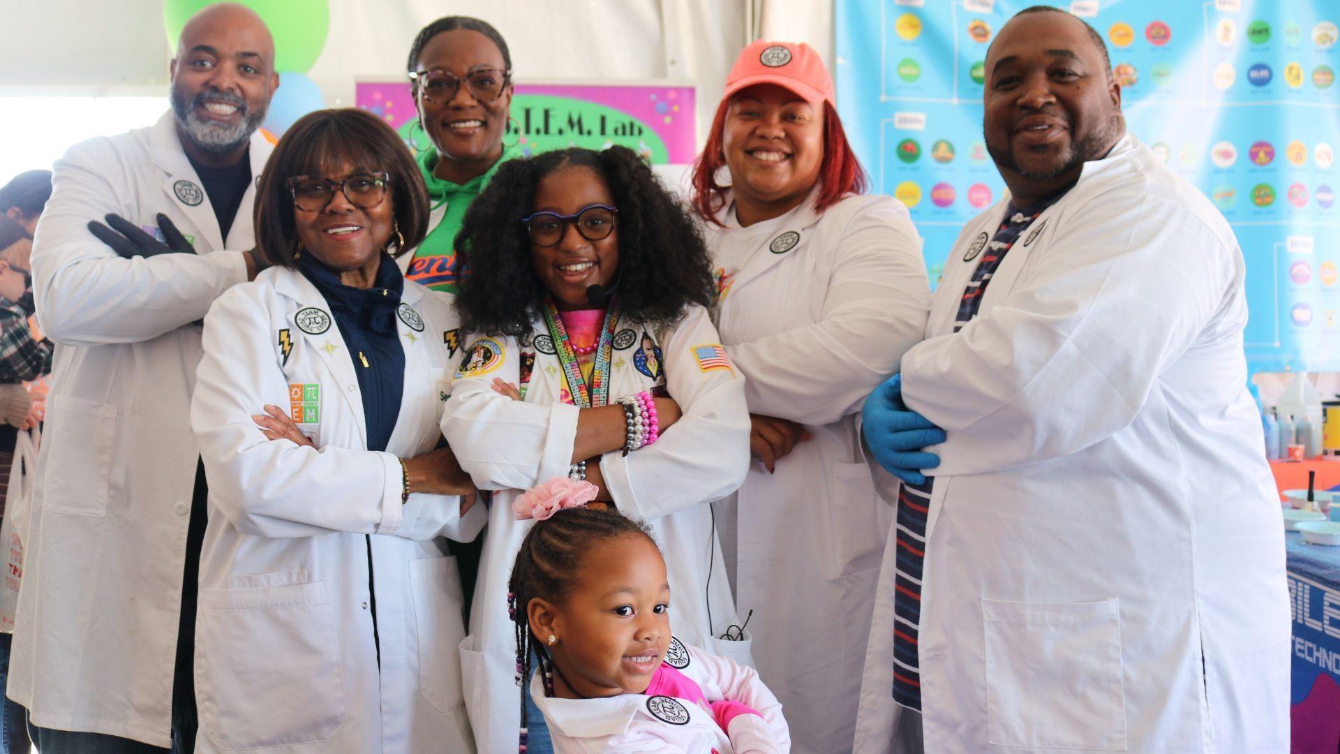 Ava the STEM Princess and her crew pose at a Rootle Roadster Tour stop.