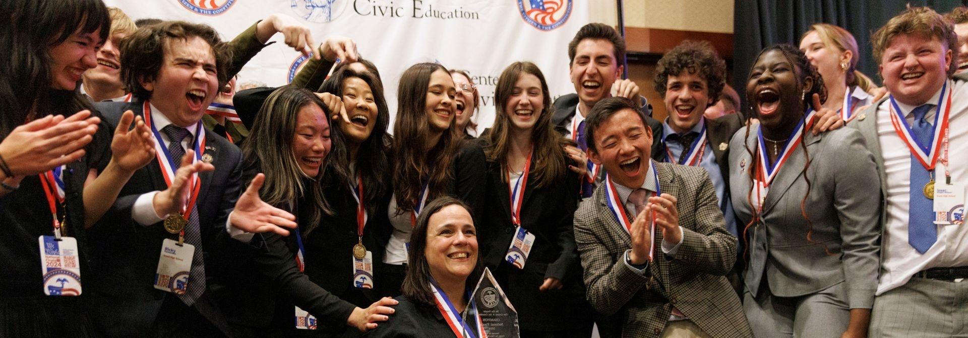 A team celebrates at the We the People national championship in Leesburg, Va.