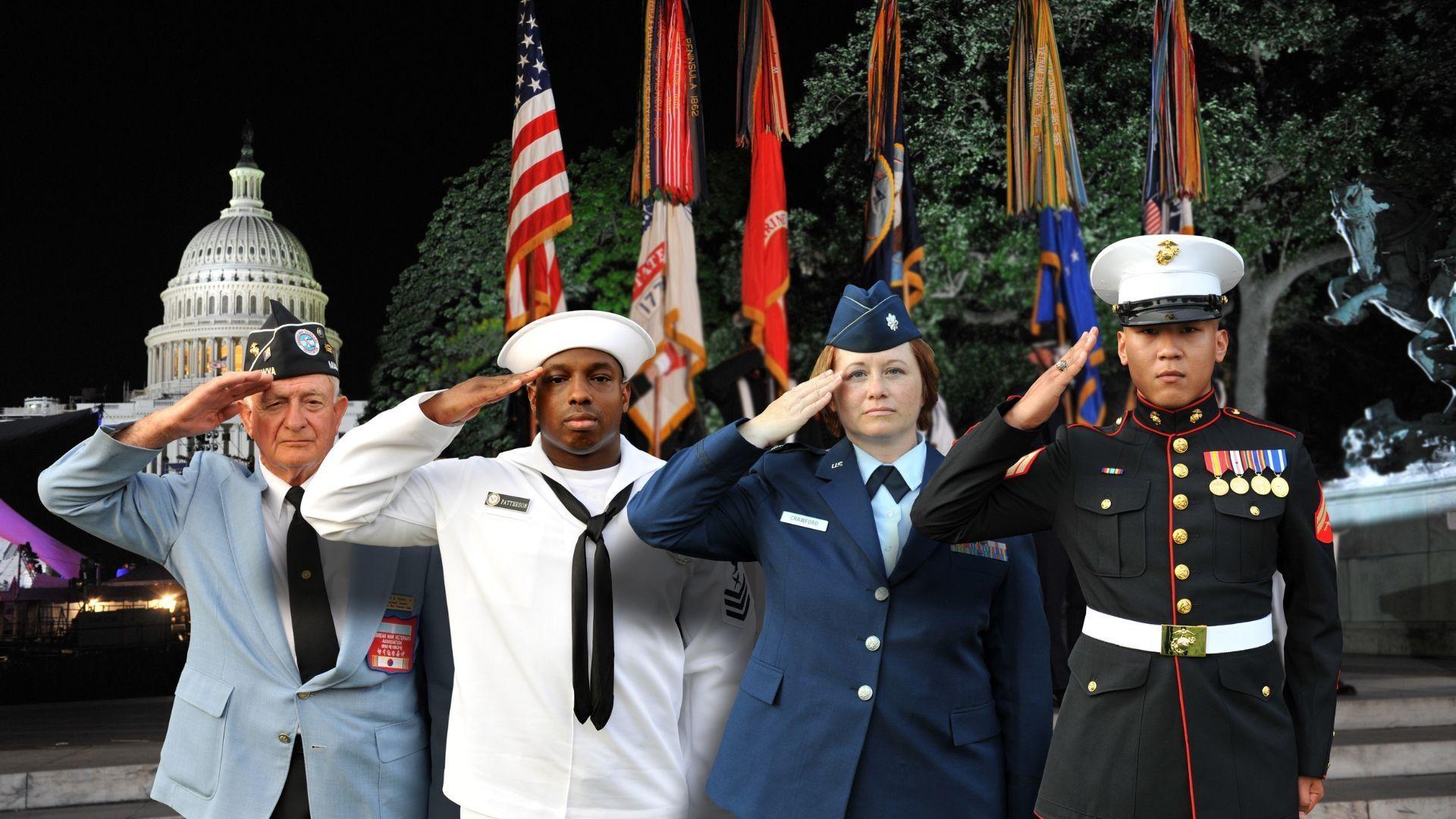 Members of the U.S. Armed Forces salute at the National Memorial Day Concert.