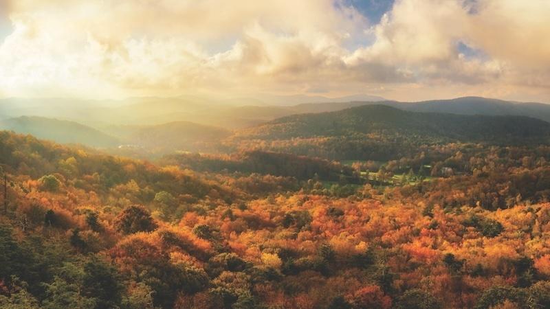 The Blue Ridge Mountains during golden hour; the leaves are many fall colors.