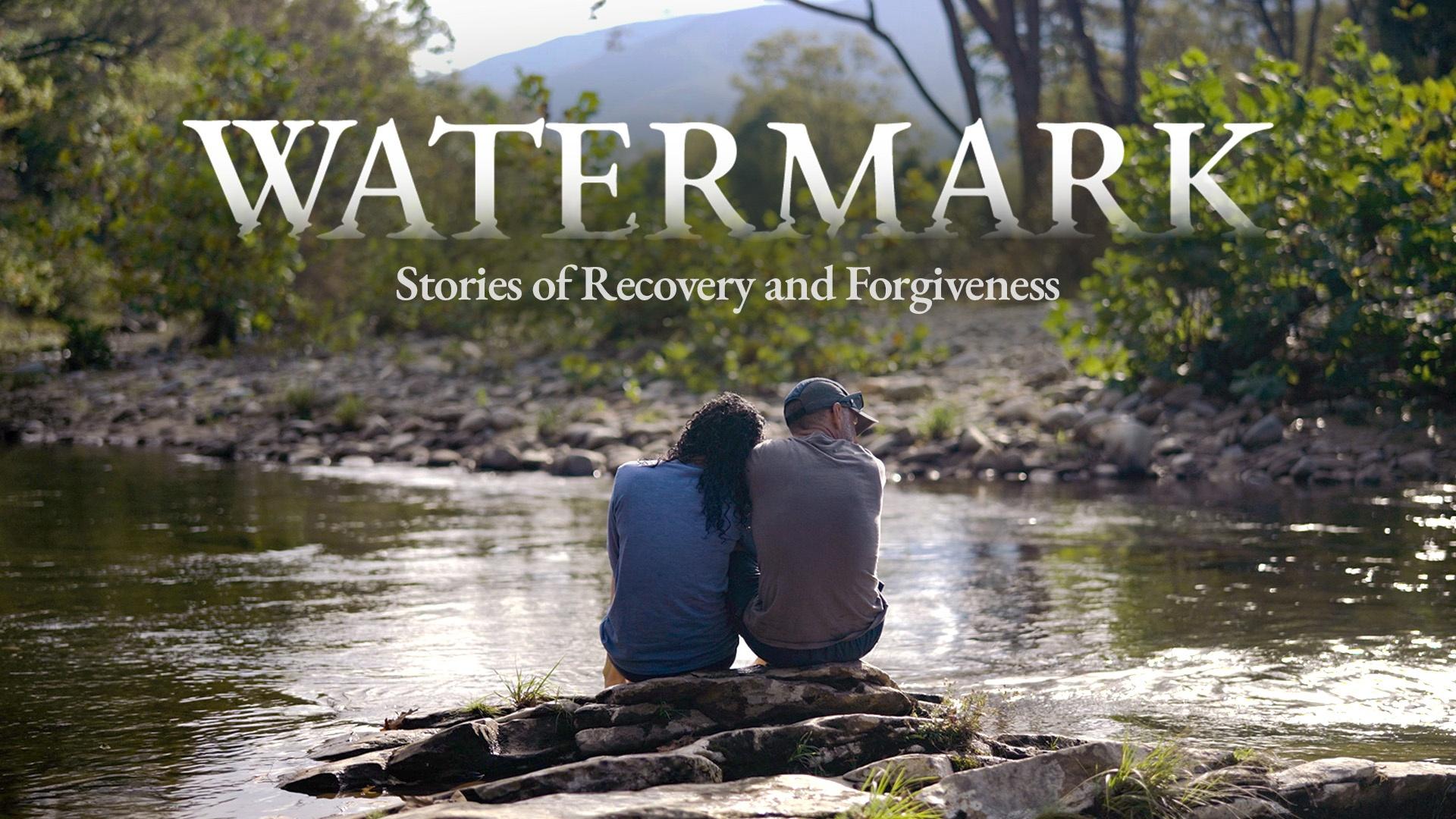 "Watermark: Stories of Recovery and Forgiveness" in white text over an image of a couple sitting next to each other on a rock in a stream.