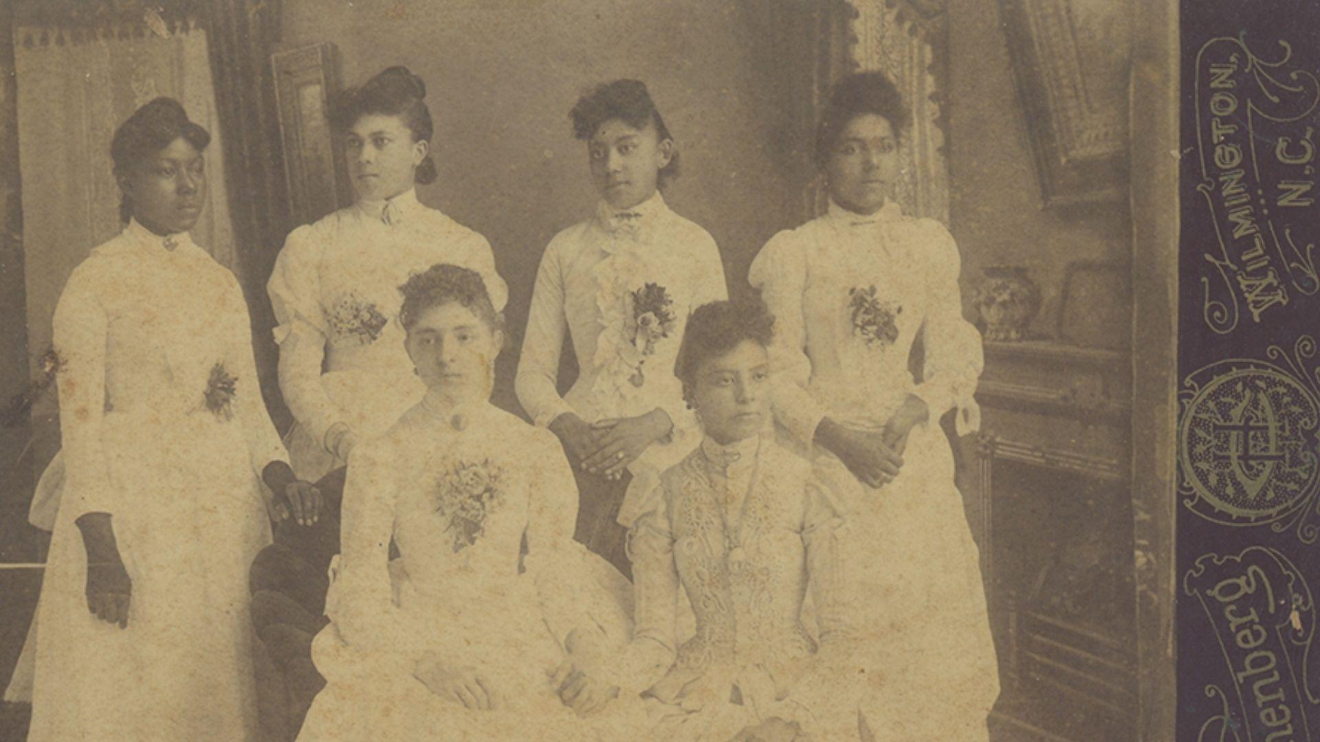 A portrait of the Sadgwar sisters printed on a cabinet card, which could be shared with loved ones or exchanged with visitors. Courtesy National Bahá’í Archives.