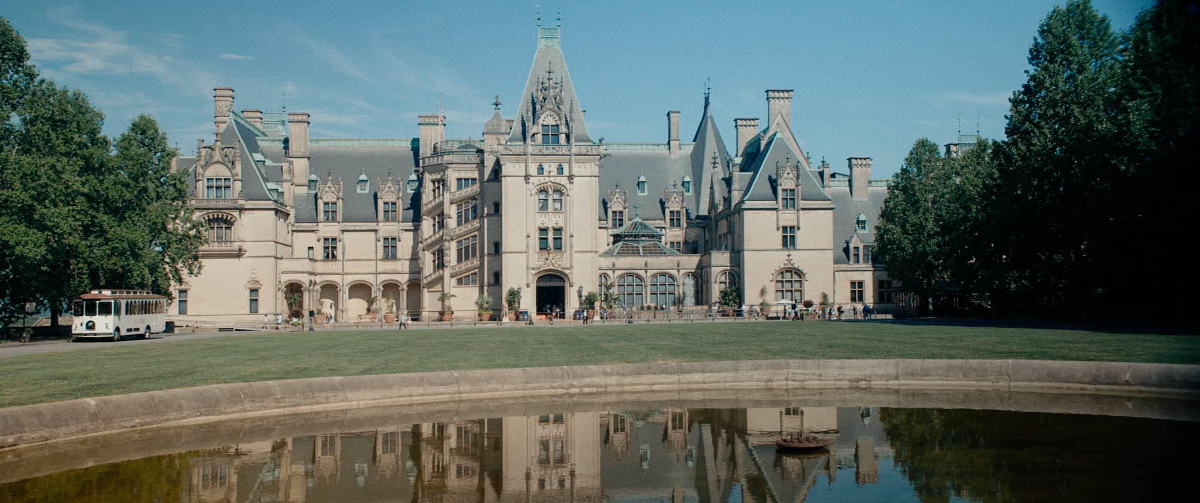 Production image from film, exterior facade with reflecting pool, Biltmore Estate.
