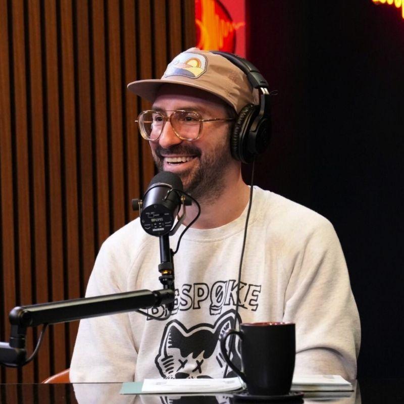 Host of Shaped by Sound, James Mieczkowski, in the podcast studio with headphones on and a mic in front of him.