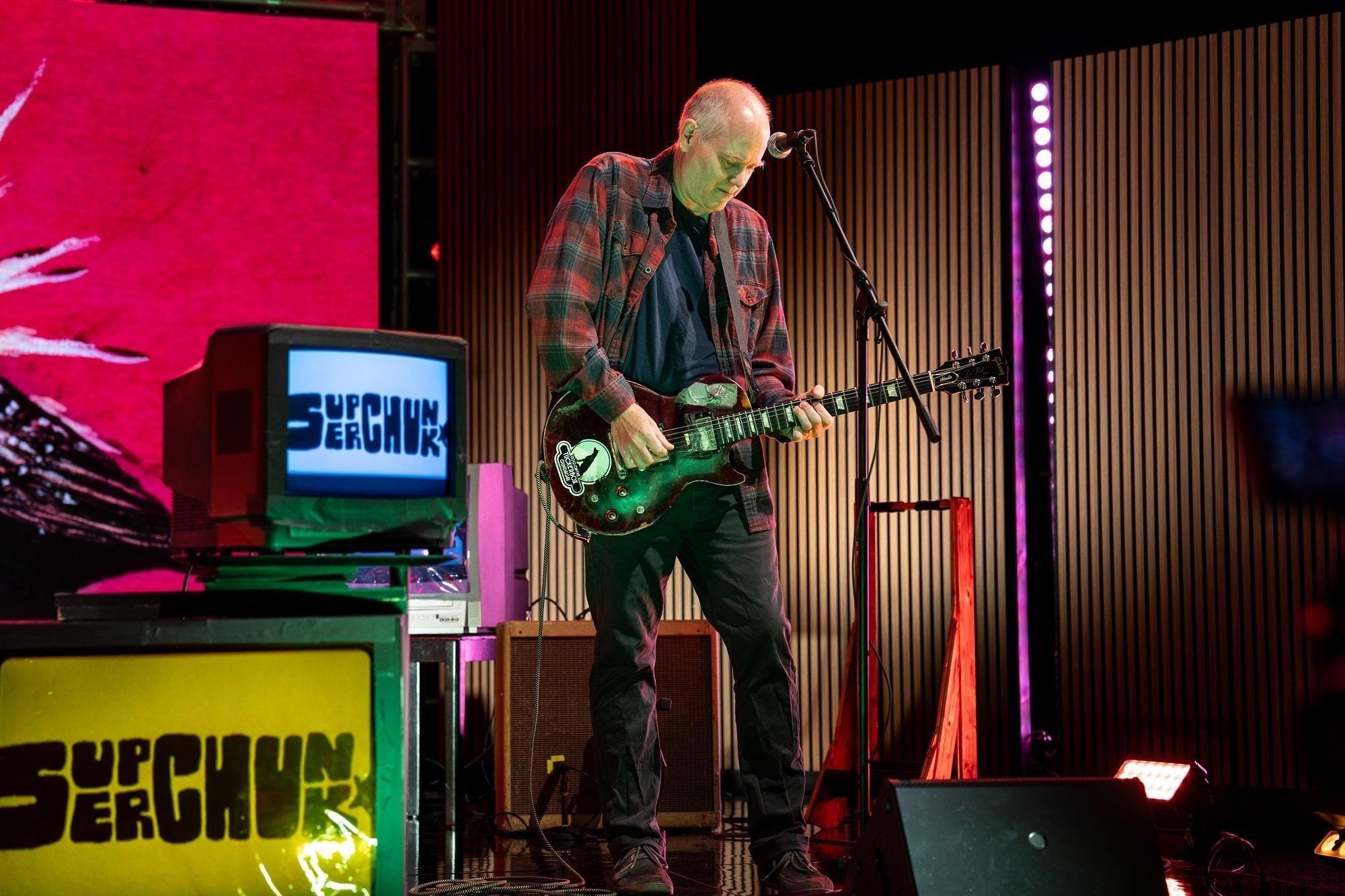 Jim Wilbur of Superchunk playing electric guitar.