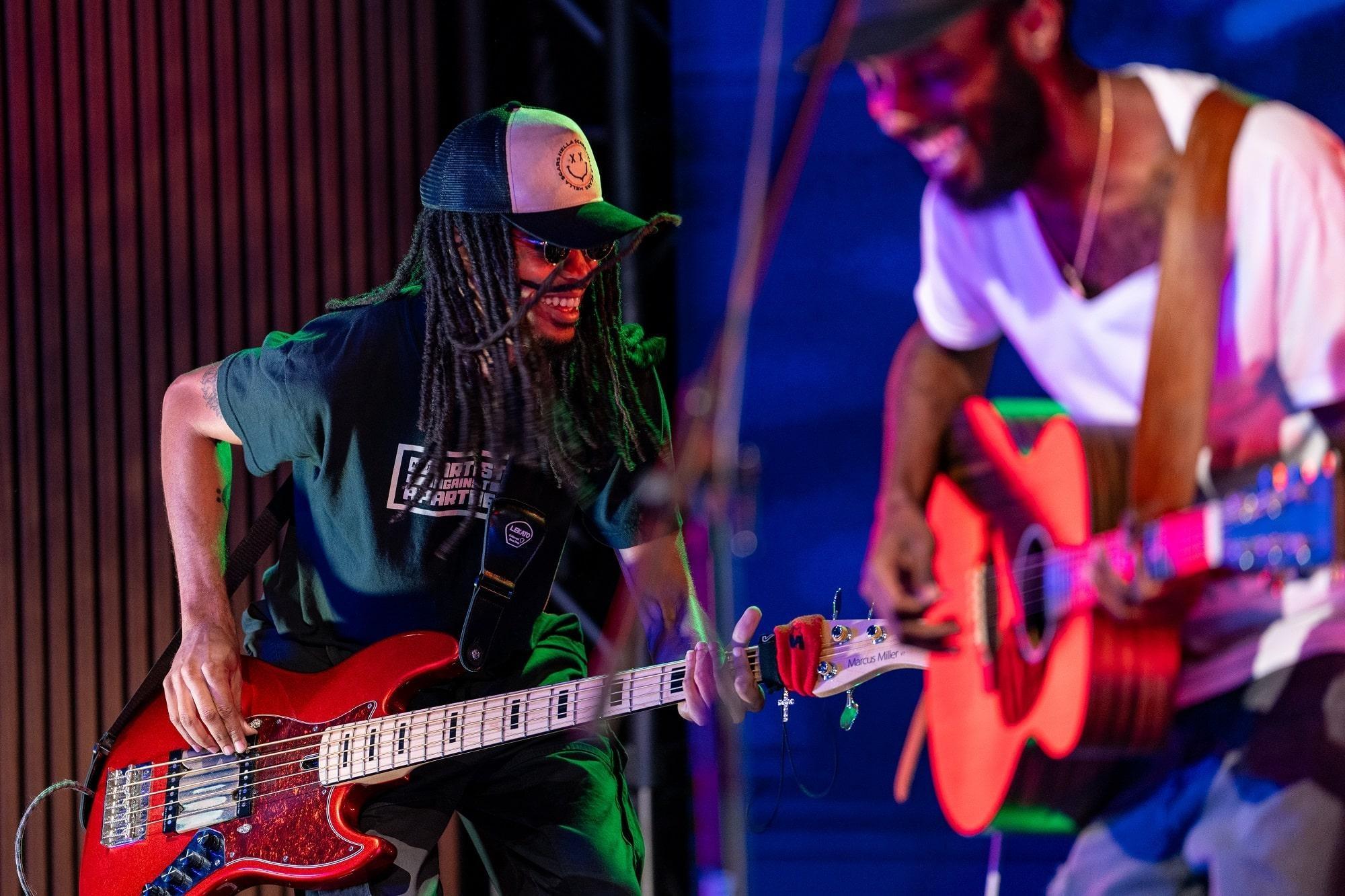 Sonny Miles and his bassist playing together on set.