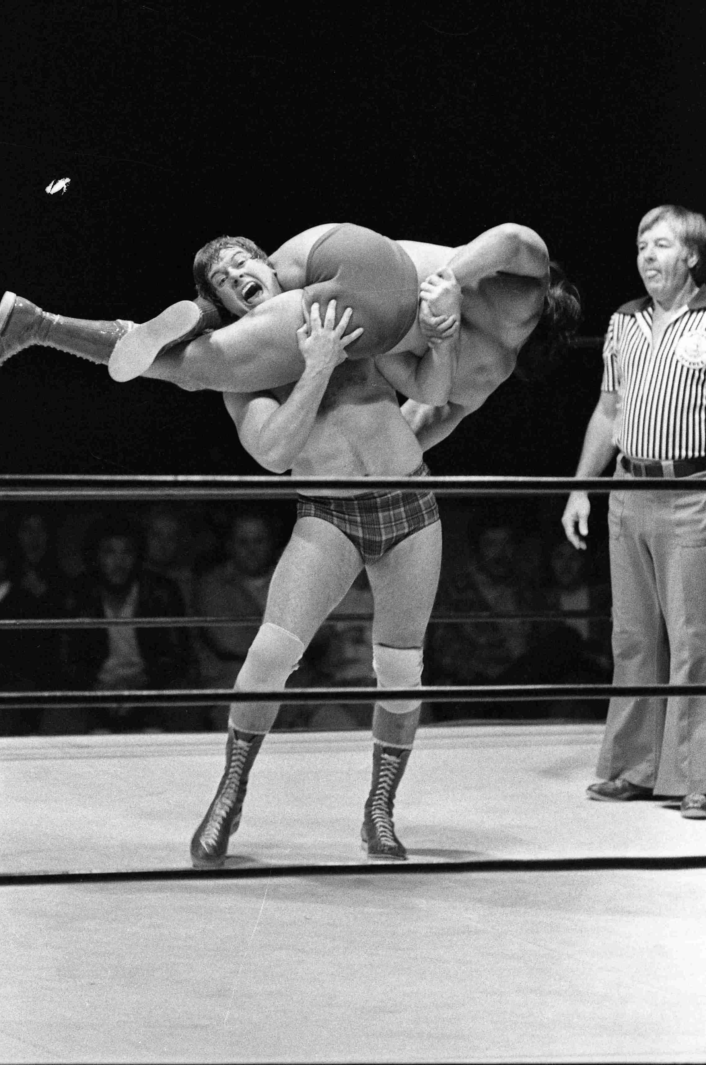 “Rowdy” Roddy Piper feels the squeeze from Ricky “The Dragon” Steamboat in Dorton Arena. November 12, 1980. Photographer: Harry Lynch.