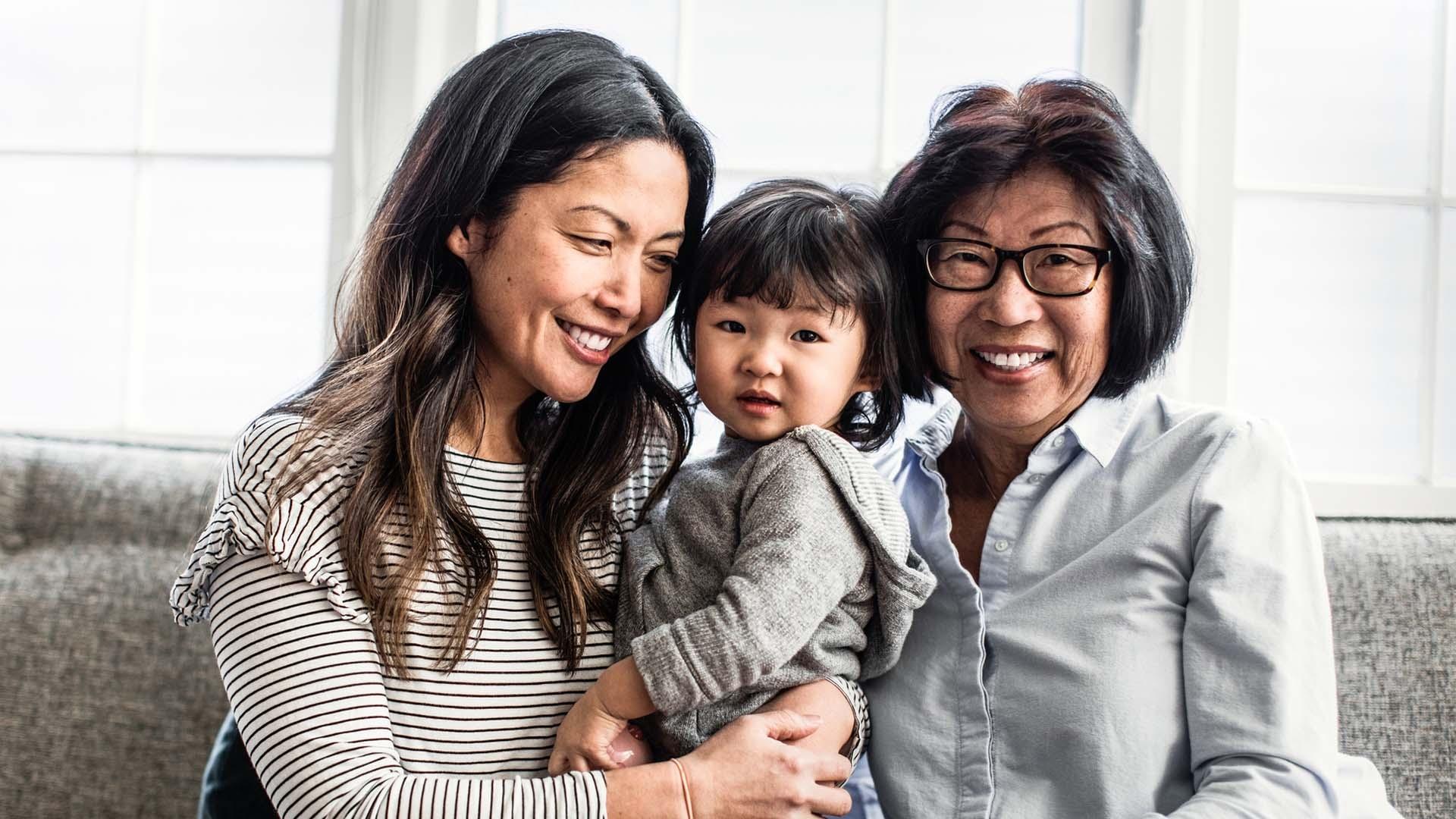 three generations asian family smiling