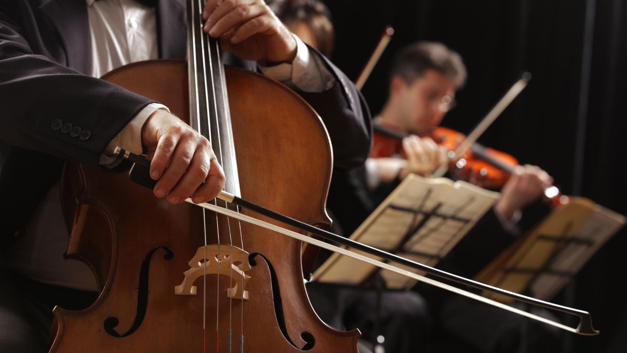 Picture of an orchestra focusing on cello player